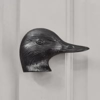 Black Duck door knocker on grey front door