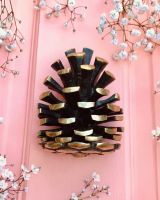 dk323_-_pine_cone_door_knocker_on_red_door with flowers
