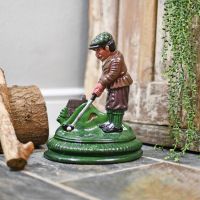 Golf enthusiast golf door porter in front of rustic door Golf enthusiast golf door porter in front of rustic door