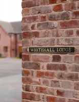 The "Warrington’ Modern Brass House Sign