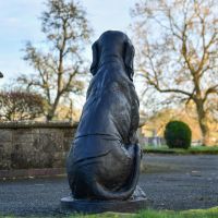 Black Sitting Bloodhound Garden Sculpture from Behind