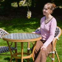 The "Pachino" 2-Seater Outdoor Dining Set Scale Shot In A Garden The "Pachino" 2-Seater Outdoor Dining Set Scale Shot In A Garden
