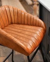 Ribbed design in tan leather.
