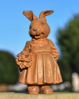 Rustic Cast Iron Rabbit Holding Flowers Sculpture Rustic Cast Iron Rabbit Holding Flowers Sculpture