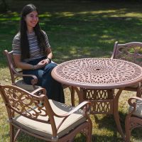 The “Rose Filigree” Deluxe 4-Seater Outdoor Dining Set - Terracotta Scale Shot In A Garden