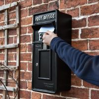 Letter being posted into "Original Reproduction" Black Post Box 
