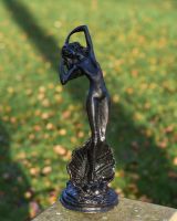 Black Statue Of A Lady In. A Clam In Situ 