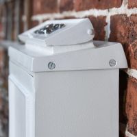 Close-Up of Side View of Simplistic Post Box on House Wall 