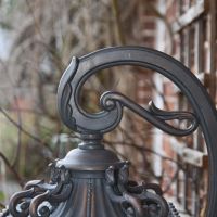 Close up of scroll bracketed supporting arm 