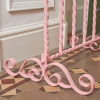 Close up of Wrought Iron Scrollwork in Pink  Close up of Wrought Iron Scrollwork in Pink