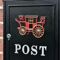 Close up of Royal Carriage Motif on Post Box 