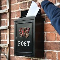 Posting a Letter into Royal Carriage Wall Mounted Post Box 