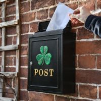 Letter being delivered into "Green Clover" Wall Mounted Post Box