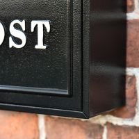 Close up of Black Wall Mounted Post Box 
