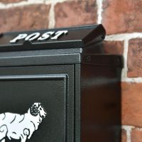 Close up of Black Wall Mounted Post Box with White Lettering and Motif 
