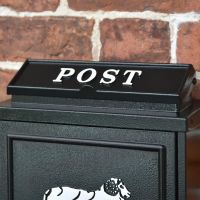Close up of "POST" lettering on "Sheep" Post Box 