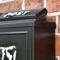 Close up of black finish on "Black & White Cow" Wall Mounted Post Box Close up of black finish on "Black & White Cow" Wall Mounted Post Box