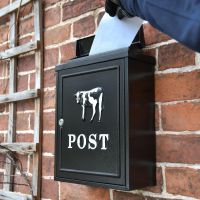 Lettering being delivered into "Black & White Cow" Wall Mounted Post Box Lettering being delivered into "Black & White Cow" Wall Mounted Post Box