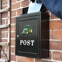 Letter being delivered into "Green Tractor" Post Box  Letter being delivered into "Green Tractor" Post Box
