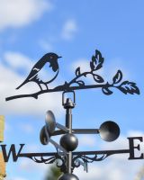 Close up of Steel Robin On Branch Weathervane