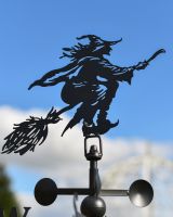 Witch on her broom details  Witch on her broom details