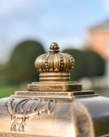 Crown details on top of “Raventree” Deluxe Camden Free Standing Post Box in Brushed Gold