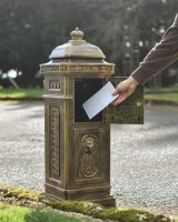 Parcel opening on “Raventree” Deluxe Camden Free Standing Post Box in Brushed Gold