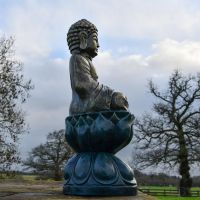 Side view of Antique Gold Buddha Sculpture Side view of Antique Gold Buddha Sculpture