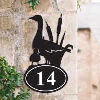Bespoke Duck Iron House Number Sign on a Garden Wall