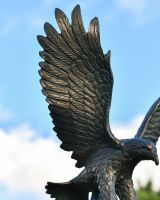 Close up of intricate feather detail on garden statue