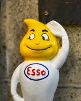 Close up of hand painted face detail on esso man money box Close up of hand painted face detail on esso man money box