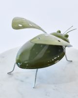 Close up of body detail on colourful enamel art sculpture