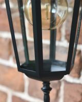 Close up of Clear Glass and Large Bulb on Outdoor Lantern Close up of Clear Glass and Large Bulb on Outdoor Lantern