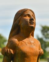 Close up of face detail on rustic garden statue