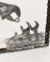 Close up of bird nest detail on scrap metal sculpture