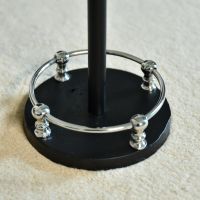 Close up of Polished Chrome and Black Circular Base