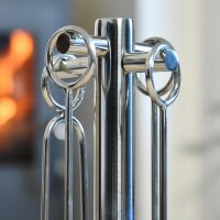 Close up of Circular Handles on Polished Stainless Steel Companion Set Close up of Circular Handles on Polished Stainless Steel Companion Set