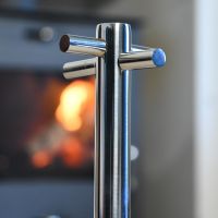 Close up of Polished Stainless Steel Companion Set Stand Close up of Polished Stainless Steel Companion Set Stand