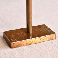 Close up of rectangular base with hammered design 