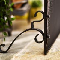 Wrought iron leg on fireguard