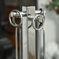 Close up of Polished Steel Companion Set Tool Handles Close up of Polished Steel Companion Set Tool Handles