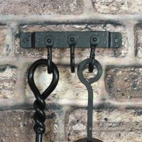 3 Hook "Blacksmith Style" Wall Mounted Fireside Tool Rack in Situ on the Wall holding tools
