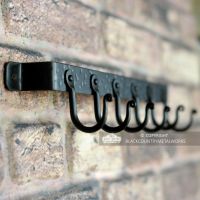 View of the hooks on the Fireside Tool Rack