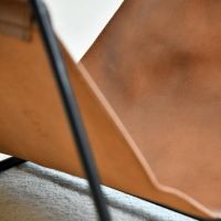 Close up of Black frame and Leather Log Holder 