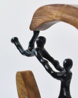 Close up of black cast aluminium figures on home decor ornament