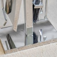Close up of rectangular stainless steel companion set base
