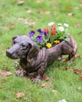 "Digby" the Sausage Dog Cast Aluminium Planter - Copper with flowers in planter