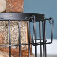 Close Up Of Small Black Wirework Fireside Log Basket Close Up Of Small Black Wirework Fireside Log Basket