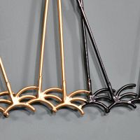 Close-up of the Brass and Black Feet on the Wall Art Close-up of the Brass and Black Feet on the Wall Art