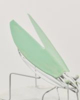 Close up of wing detail on colourful enamel bug sculpture